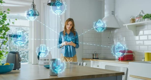 Woman standing in smart home kitchen  (1)